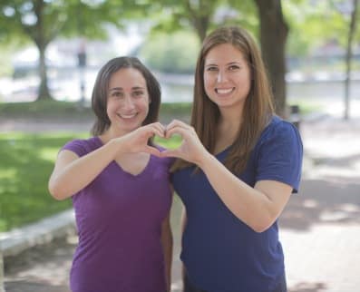 Girls forming heart love